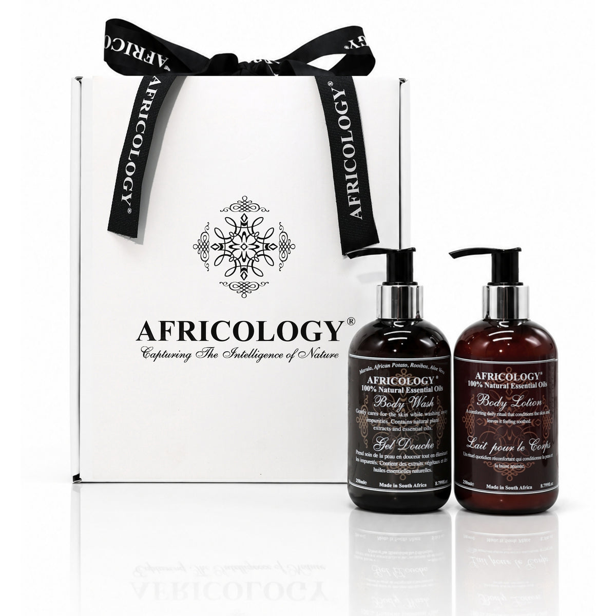 Africology bespoke white and black gift box with signature ribbon beside two 250ml Africology pump bottles