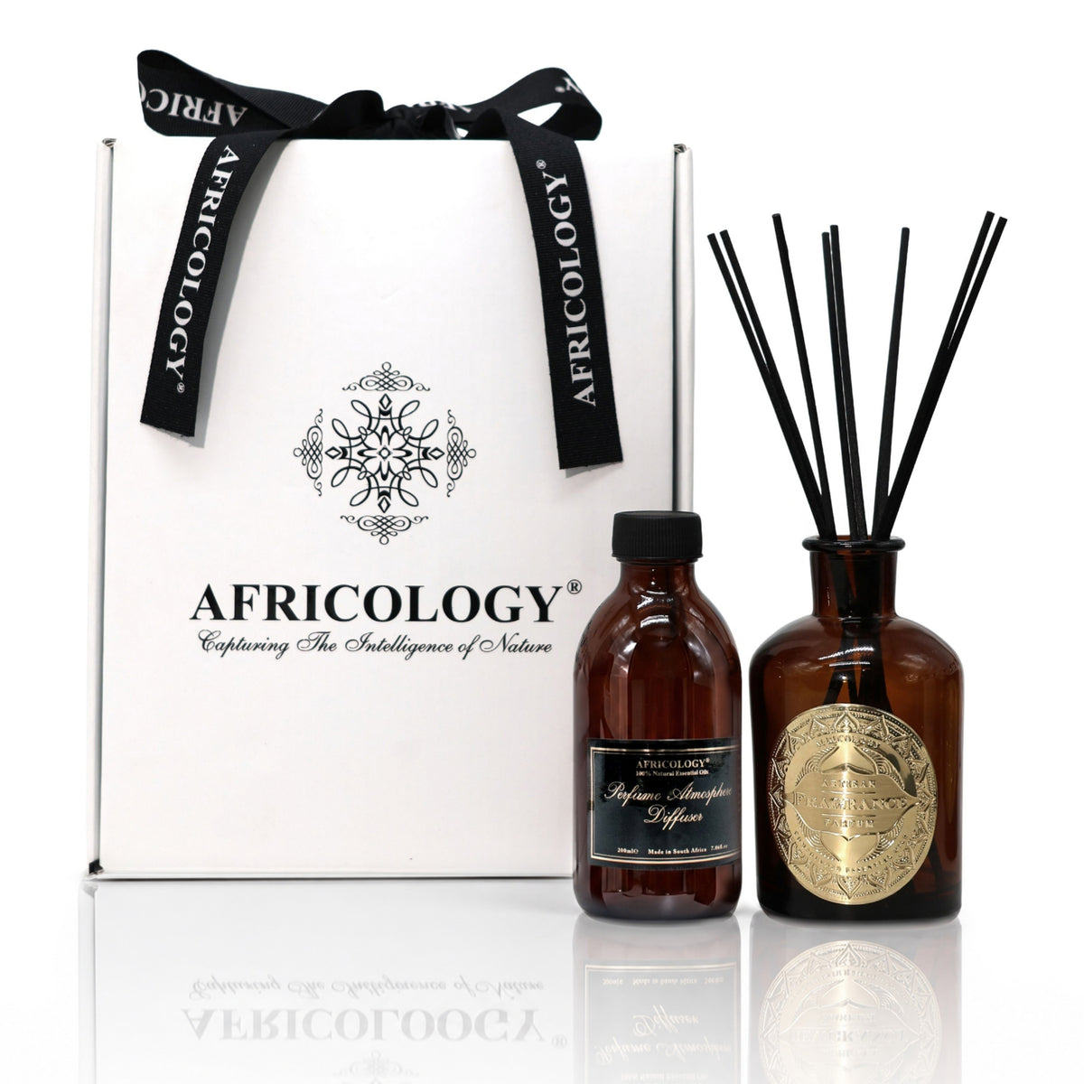Africology reed diffuser and 200ml refill beside the bespoke white and black Africology gift box with ribbon